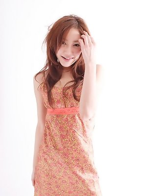 Long haired babe Remi Kawashima enchants in her pink dress